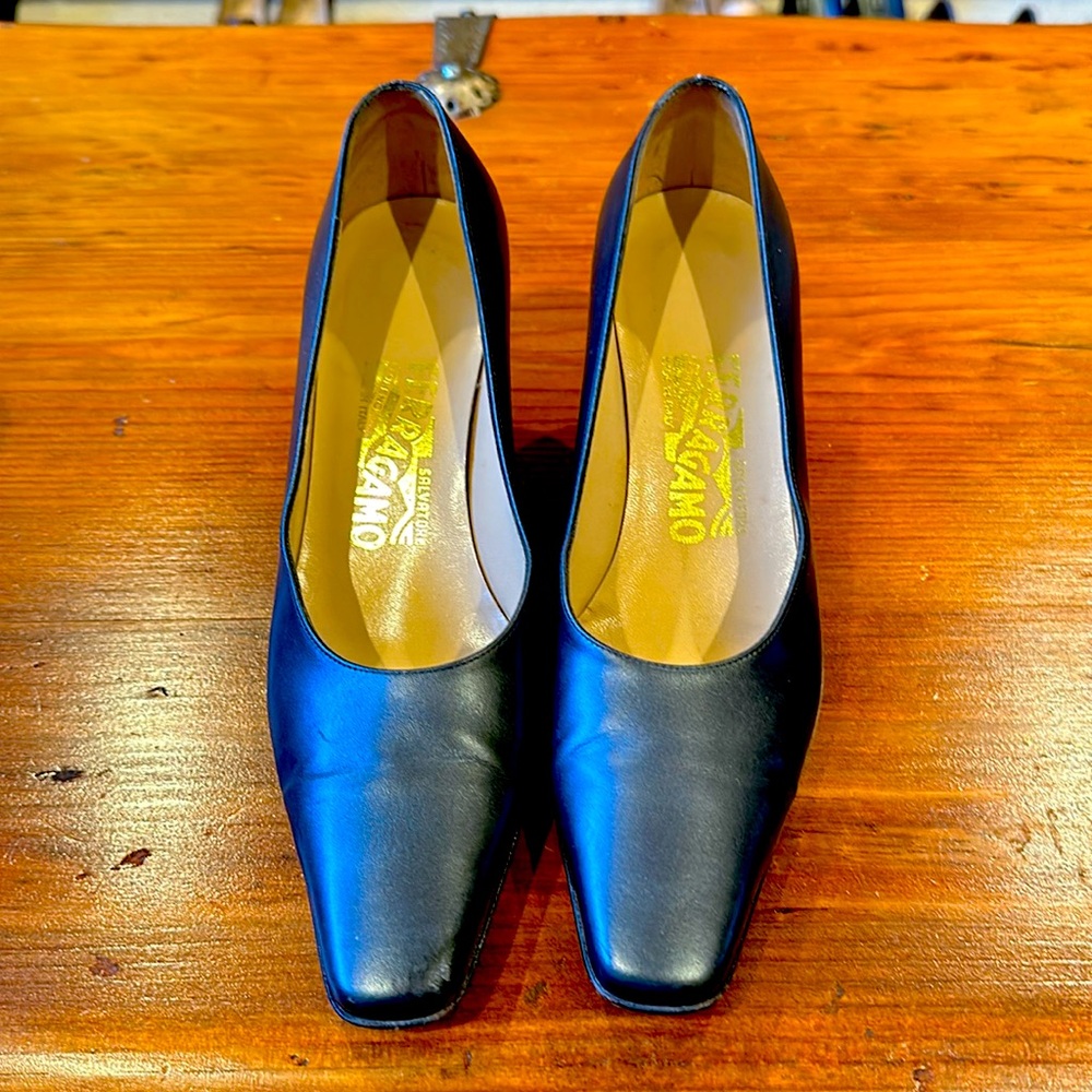 Salvatore Ferragamo metallic blue pump with metal detail on the heal size 6.